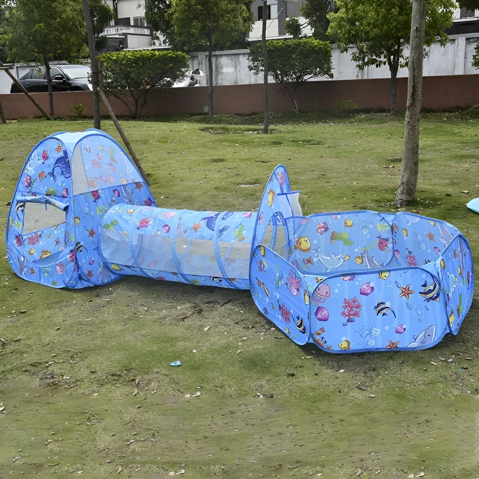 Children's three-in-one cloth play tent set with ball pool and tunnel in a cartoon marine or vehicle theme.