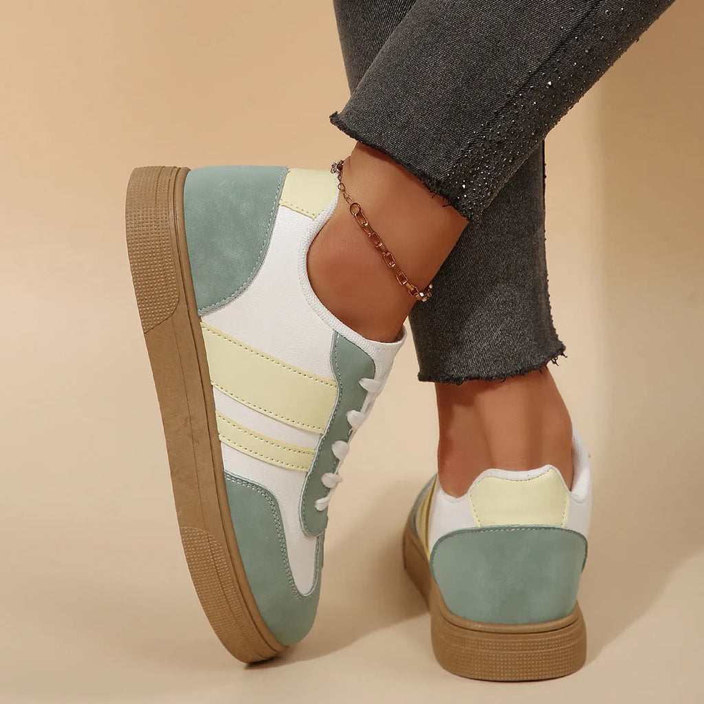 Green women's retro casual pumps with cross straps, low heel, and round toe.