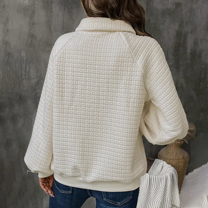 Beige women's textured knit sweater with a polo collar and long sleeves.
