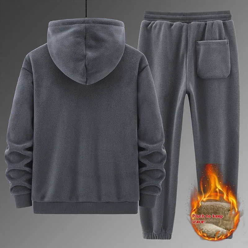 Grey men's casual sports suit with hooded sweater and matching trousers laid flat.