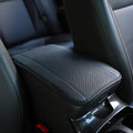 Automotive fibre leather embossed armrest box mat measuring 32x19cm in black with red cord detailing