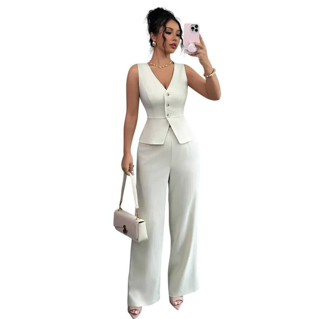 Women's sleeveless vest and high-waist trousers two-piece set in solid colour polyester fabric.