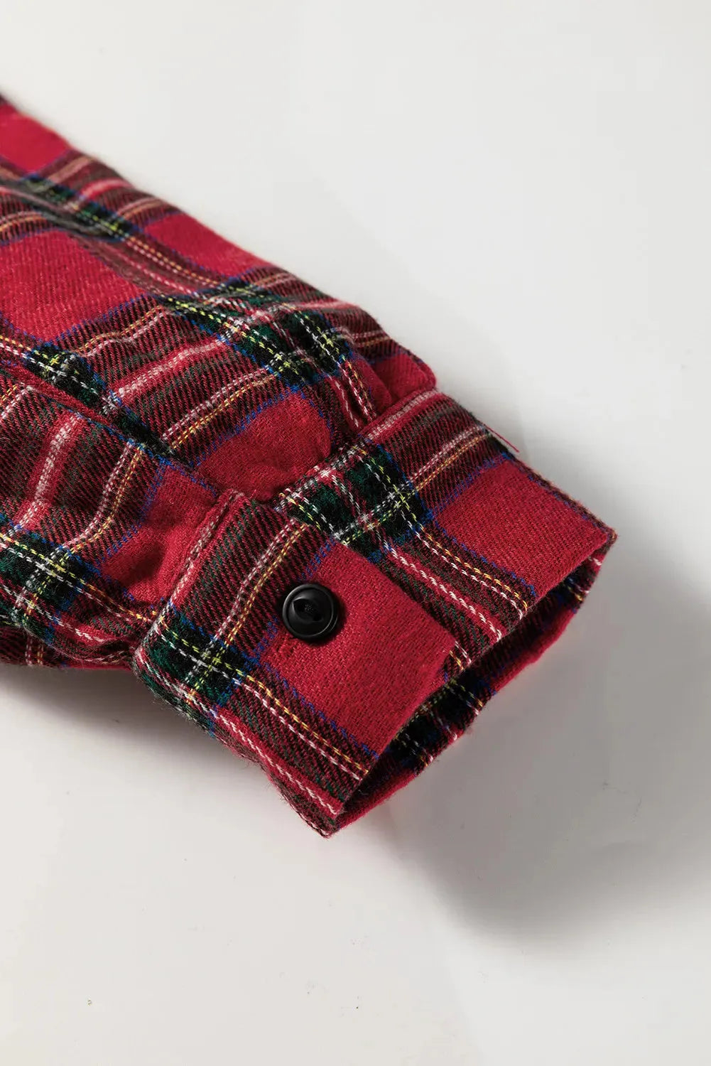 Red and black plaid women's mini dress with a shirt collar, long sleeves, and a ruffled hem.