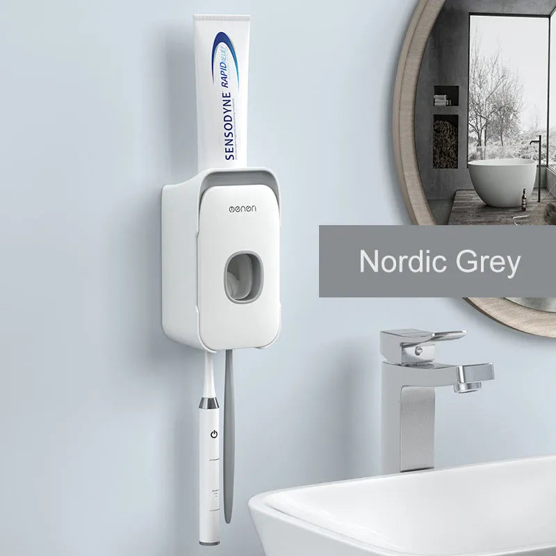 Automatic toothpaste dispenser wall mounted unit in blue, grey or pink colours with no-drip nozzle