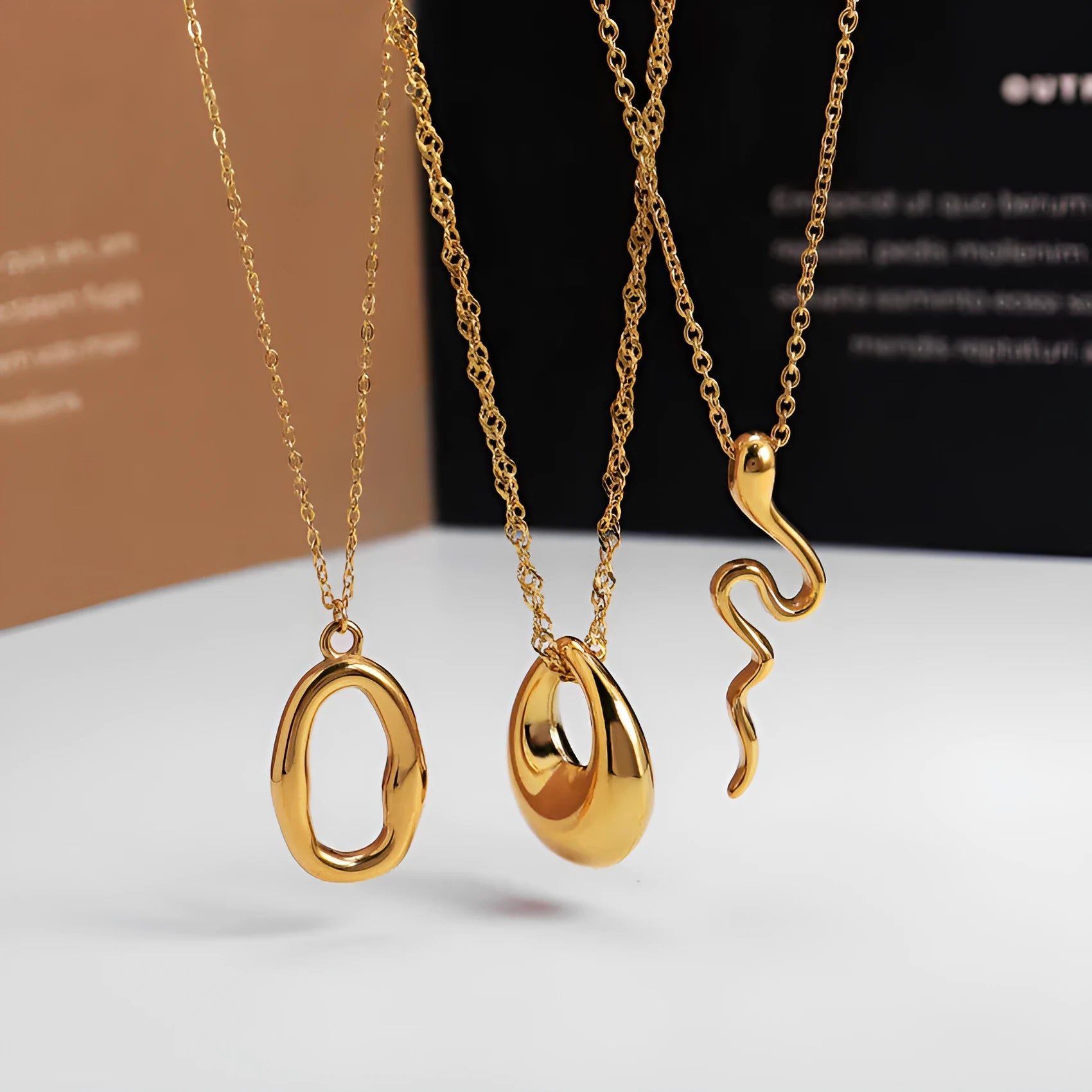 Stainless steel snake bones chain necklace with geometric glossy ring pendant in golden irregular ring finish