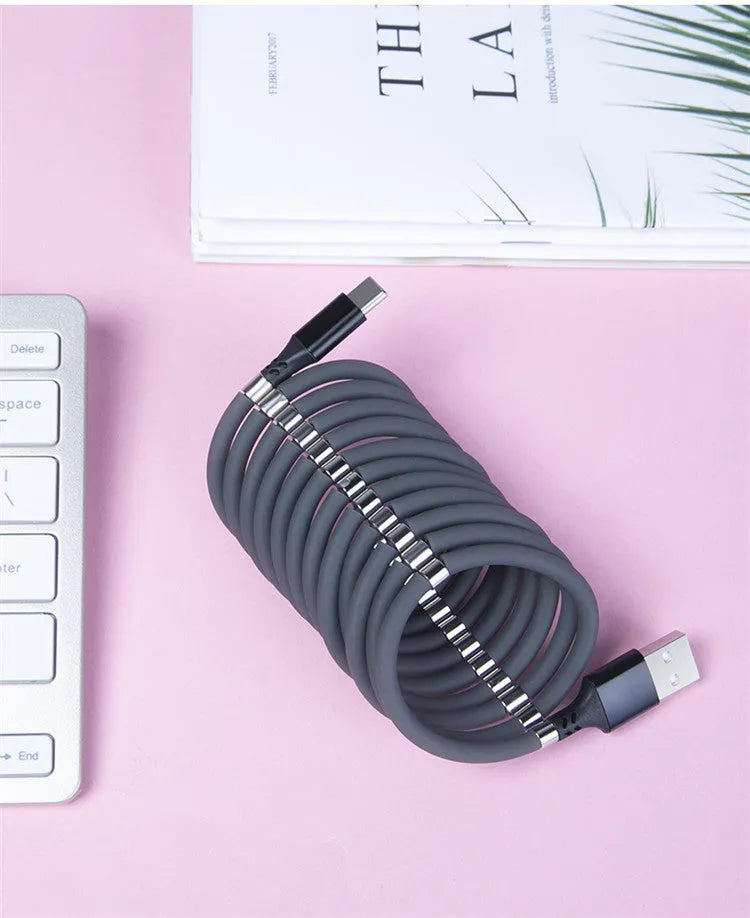 Black magnetic data cable showing Micro USB, USB Type-C and 3.5mm connector interfaces with ends snapped together