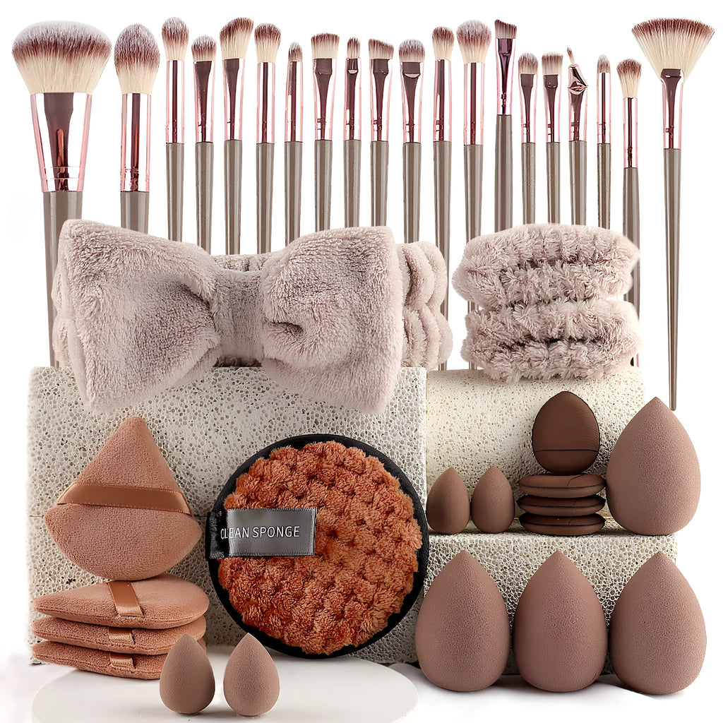 Beauty tool combination set with multiple pieces in brown, pink and purple colours for makeup and skincare