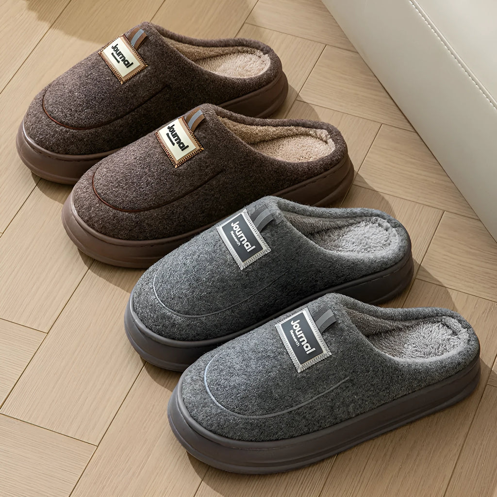 Men's brown suede slippers with thickened sole on wooden floor