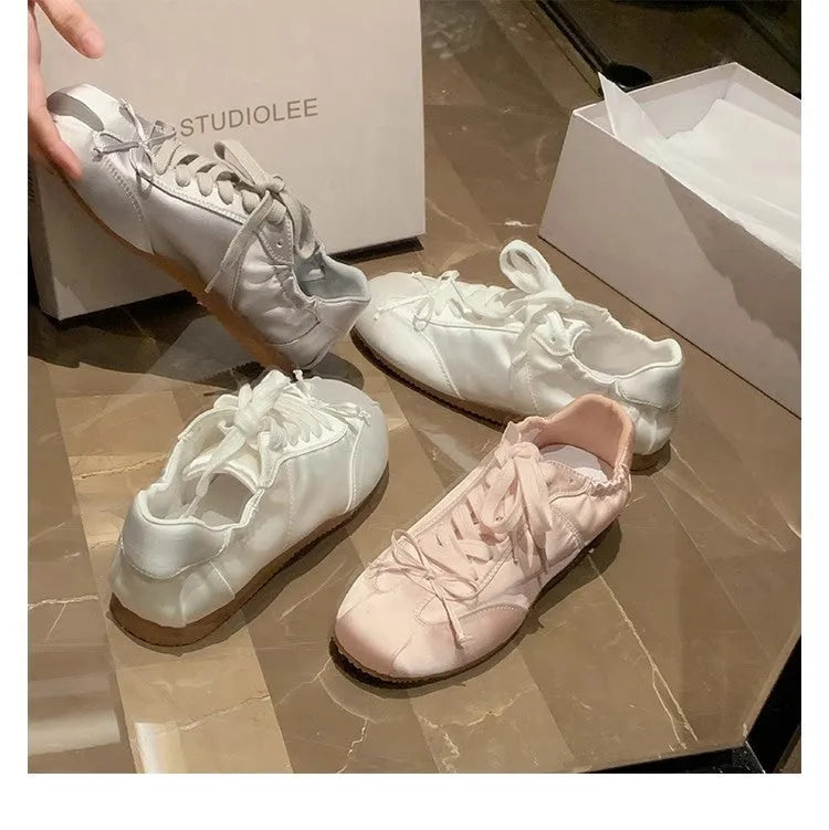 Women's ballet-style satin sports board shoes with round toe and front lace-up fastening in three colour options