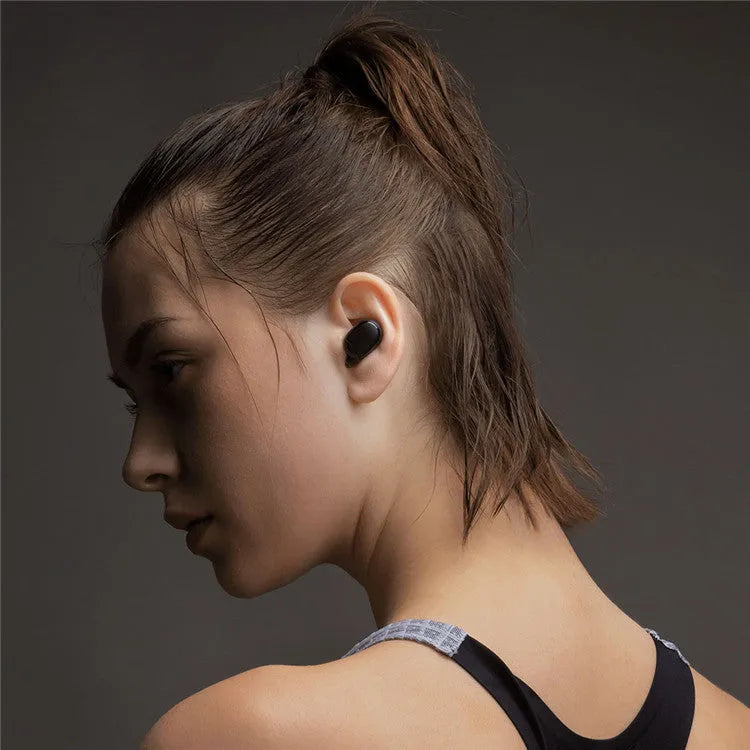 Black Redmi AirDots 2 true wireless earbuds and charging case on a white background