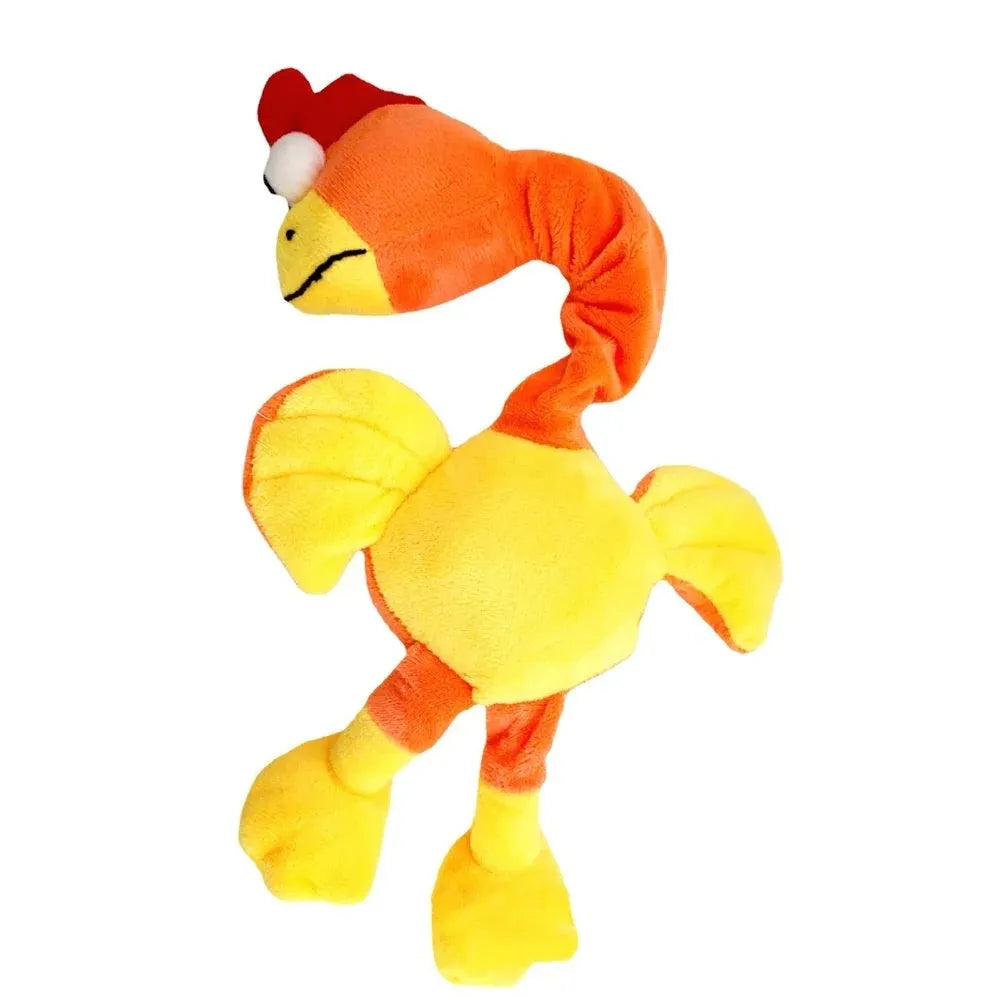 Black, green, and orange screaming chicken sound squeaky dog chew toy on a plain background