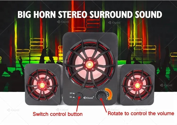 Green 2.1 USB computer speaker with colourful LED lights, showing USB and audio jack ports on a desktop.