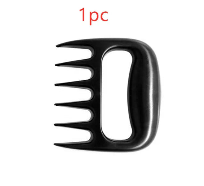 Two black PC bear claw meat shredders on a cutting board, ready for barbecue use