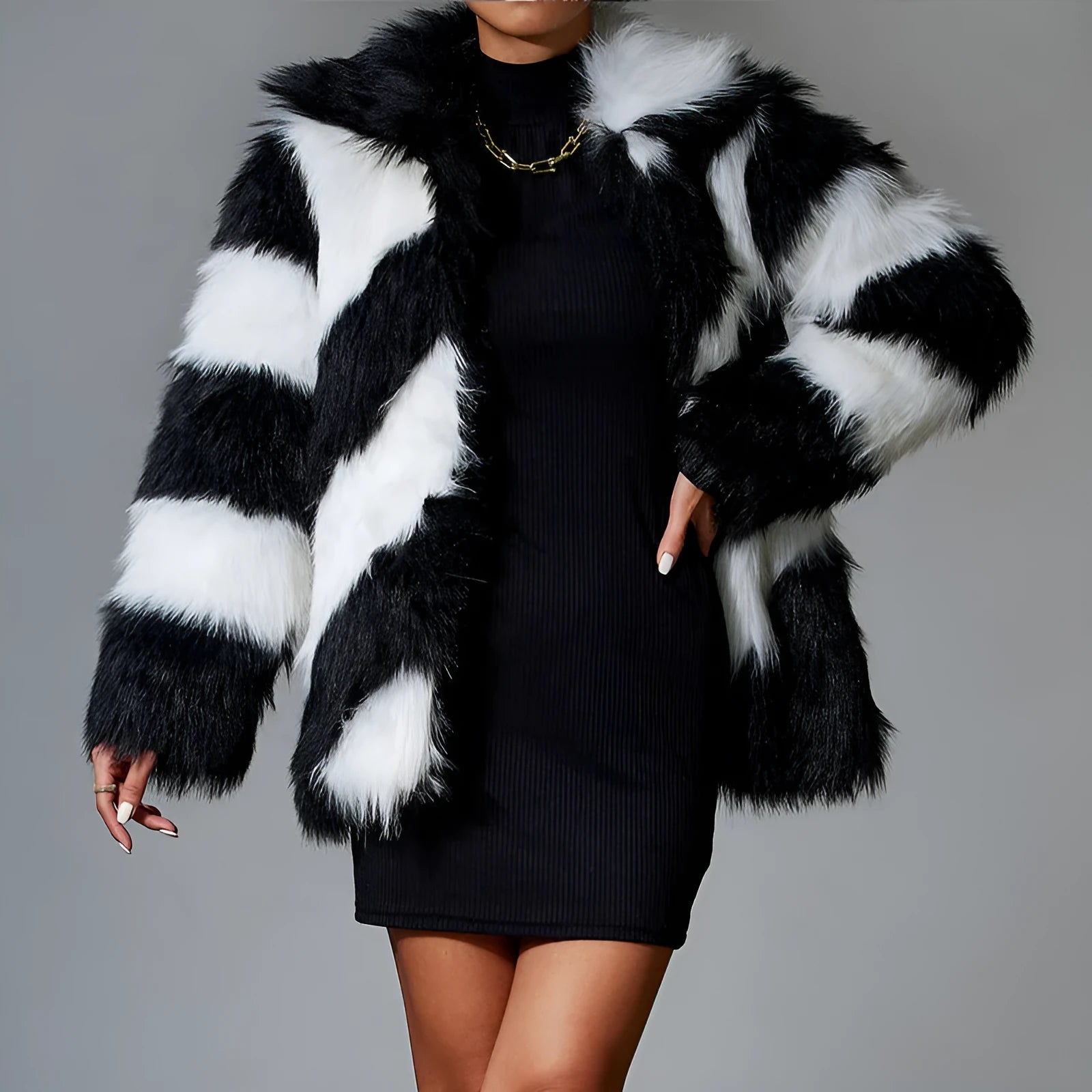 Women's grey faux fur coat with black contrast lapel and a large detachable faux fur collar.