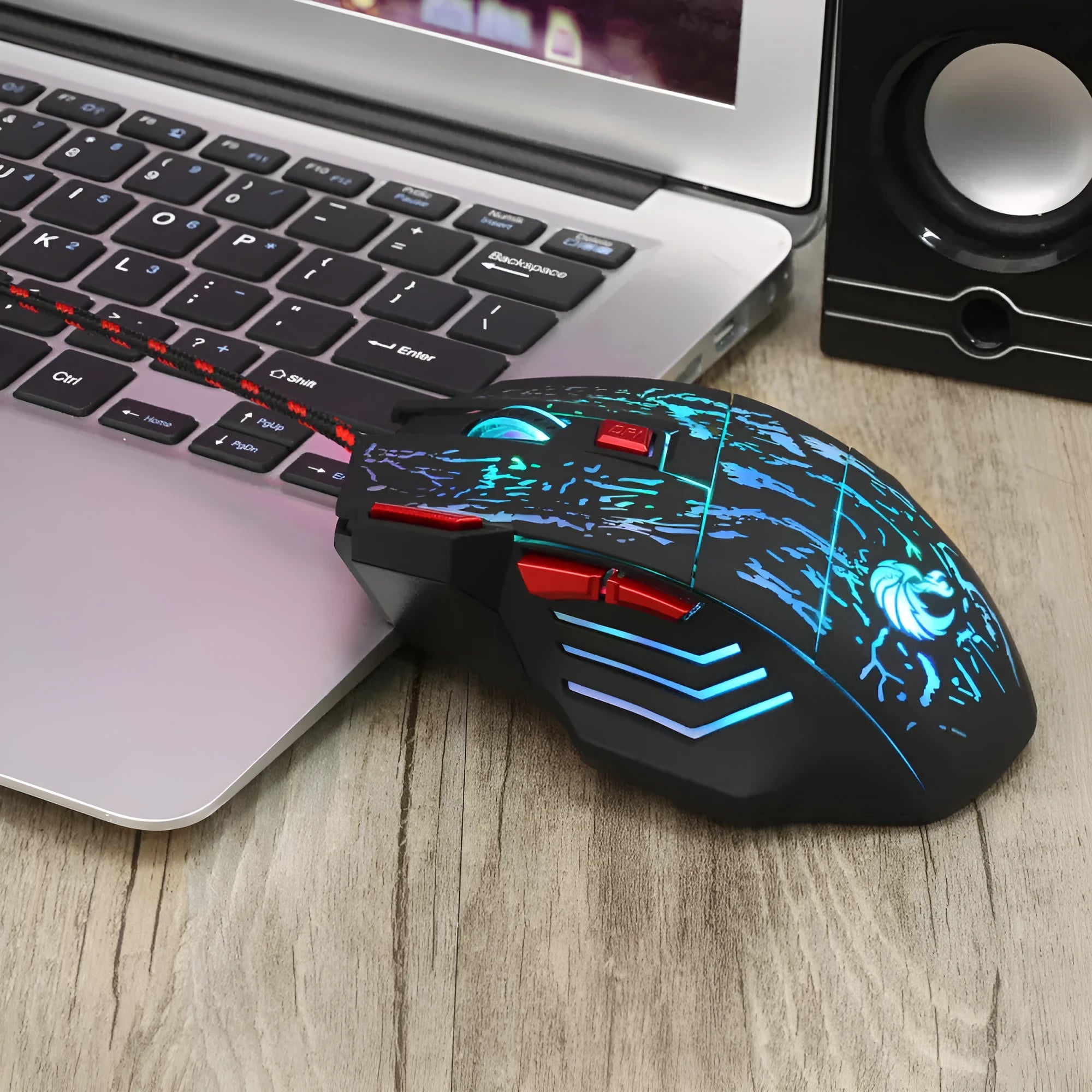 Black gaming mouse with colourful luminous lighting effects and USB cable