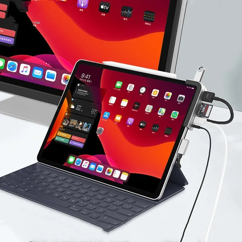 Silver aluminium grey USB-C 6-in-1 docking station for iPad Pro, showing HDMI port and card reader slots.
