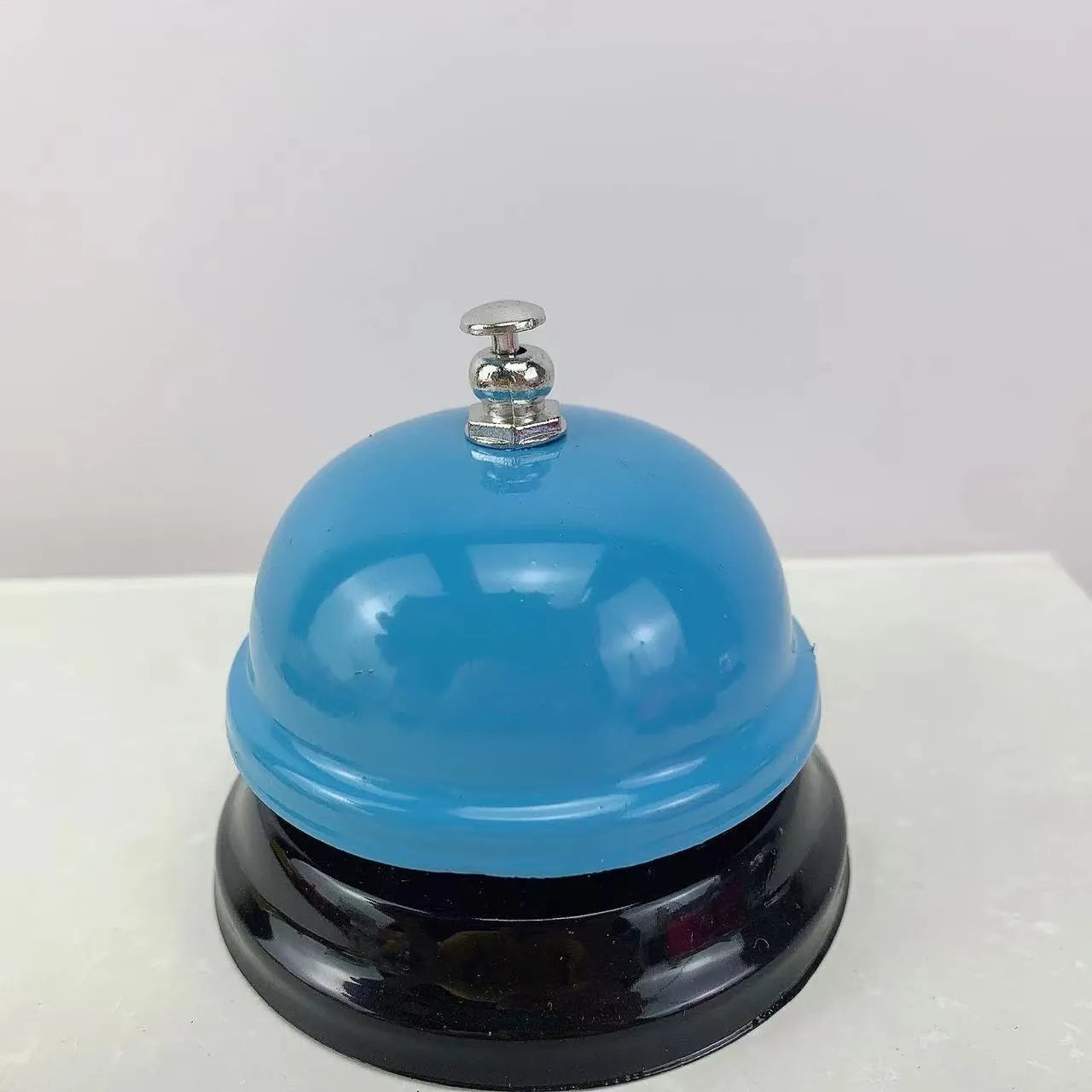 Iron handheld bell in selected colour for classroom games or restaurant service.
