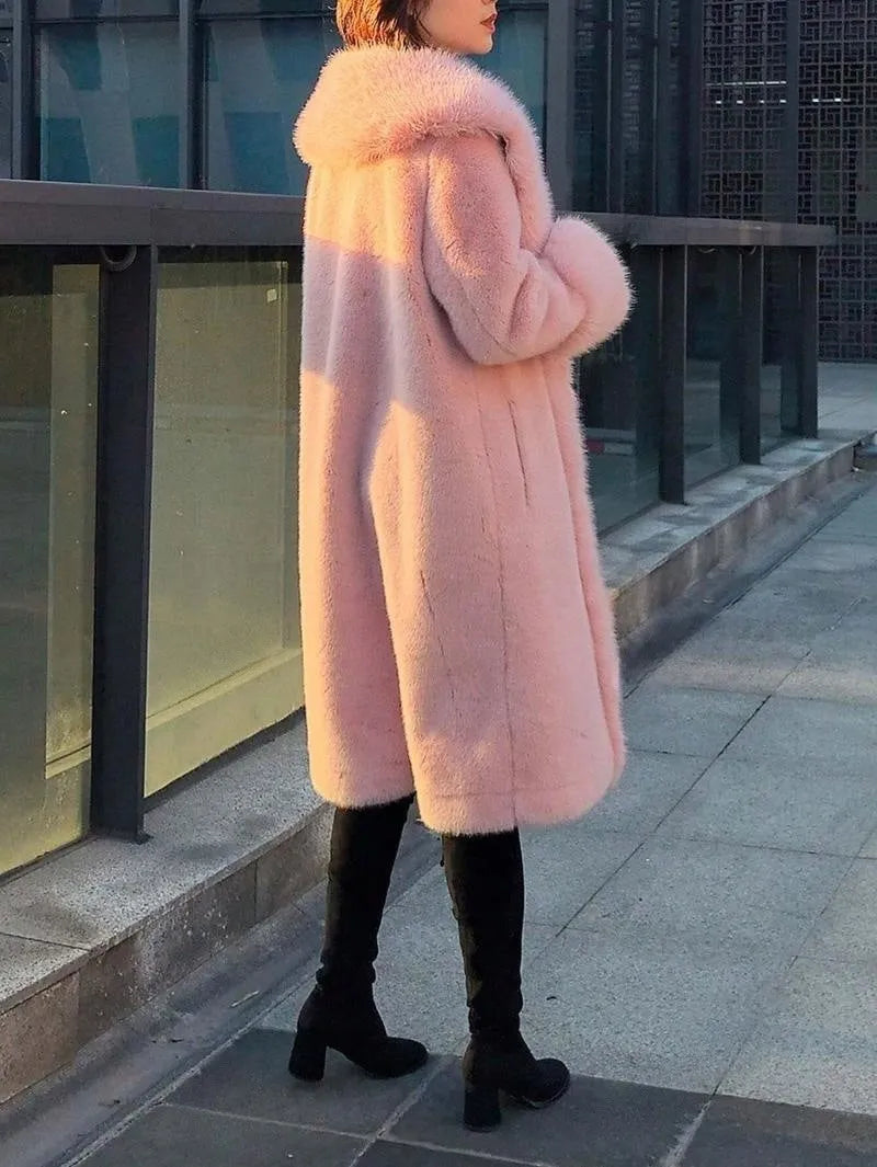 Women's grey faux rabbit fur mid-length coat with artificial fur collar and leather trim.