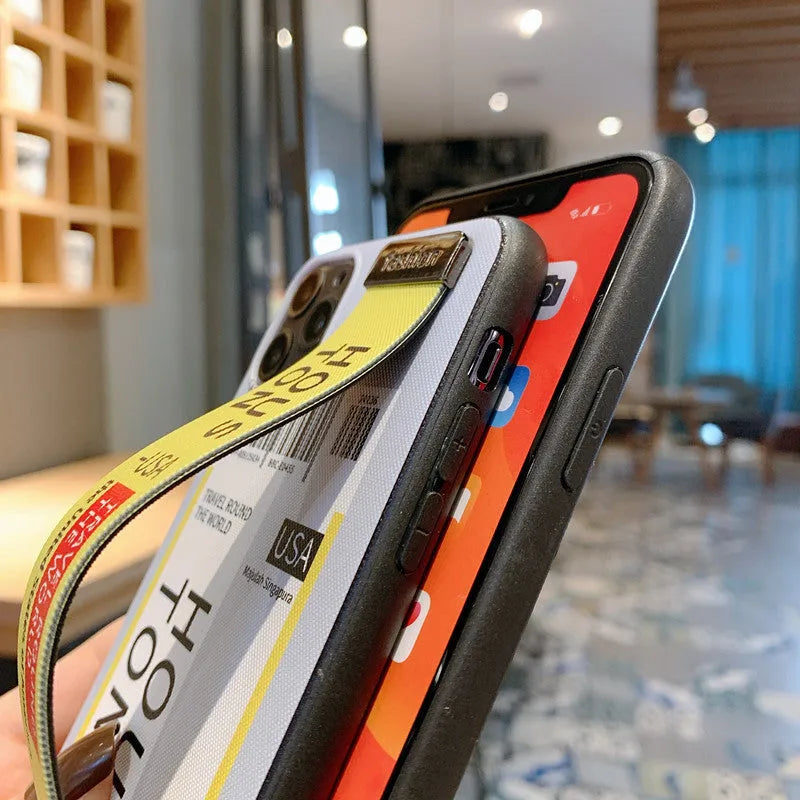 Red TPU and PC iPhone case with a built-in wristband, shown next to violet and yellow colour options.