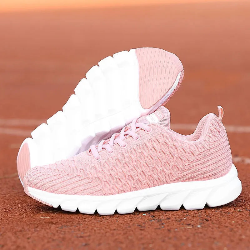 Women's running shoes in black, pink, or white with fly weave upper and wear-resistant sole