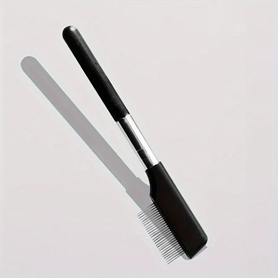 Black pet eye grooming brush with soft bristles and comb attachment for tear stain removal