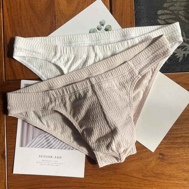 Men's solid colour pure cotton triangle underwear briefs on a white background.