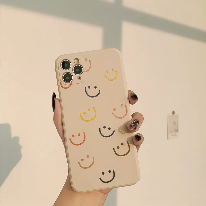 Simple silicone iPhone case with painted graffiti and stripe designs on a TPU back cover.
