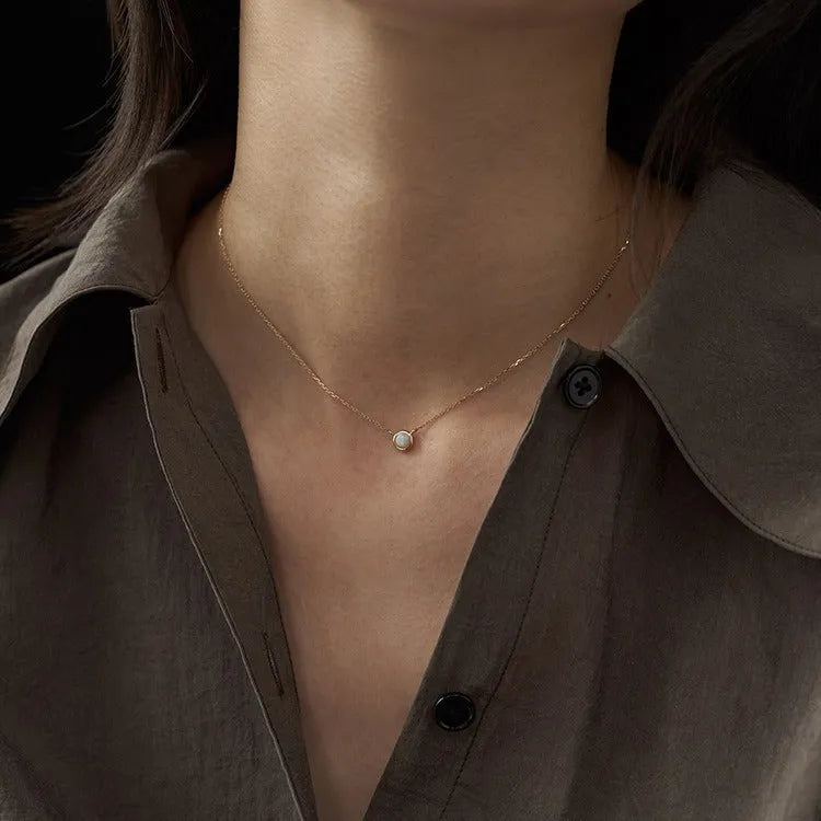 Oval geometric jelly opal pendant necklace in sterling silver with gold or white gold plating.