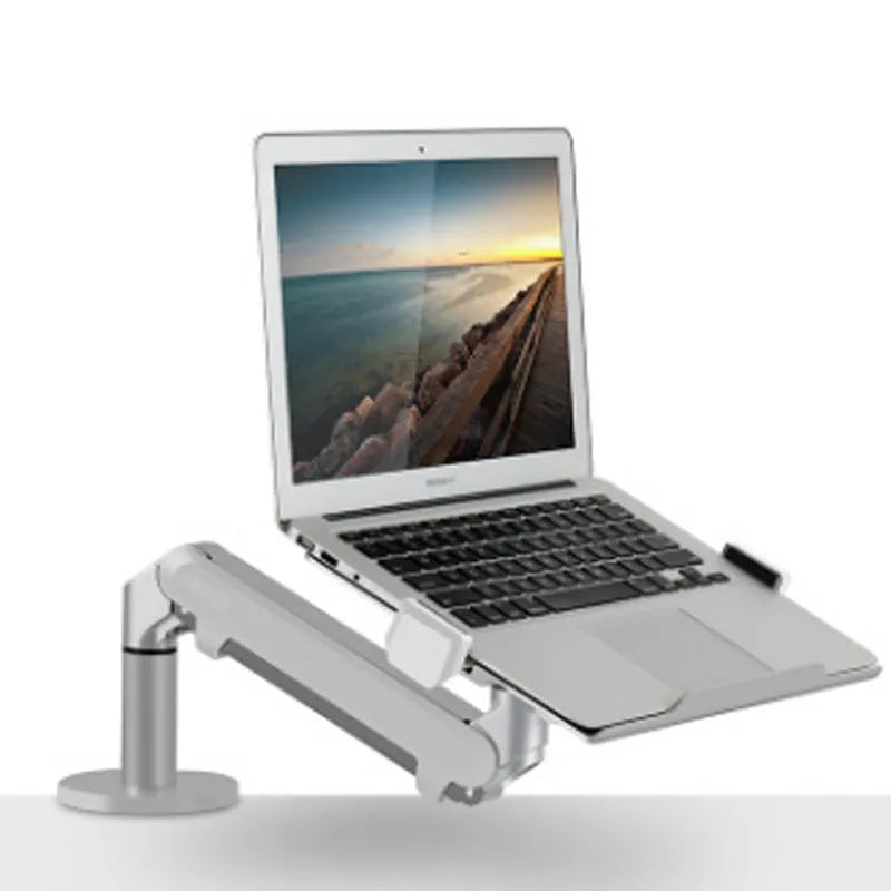 Silver aluminium laptop stand with adjustable air pressure arm holding a notebook above desktop