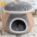 Grey mushroom-shaped plush cat bed on a wooden floor