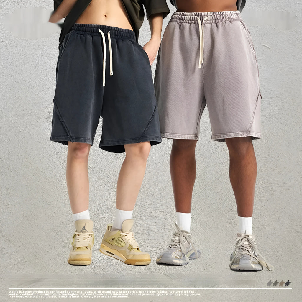 Man's loose-fit cotton terry shorts in a batik wash colour, showing street-style casual design.