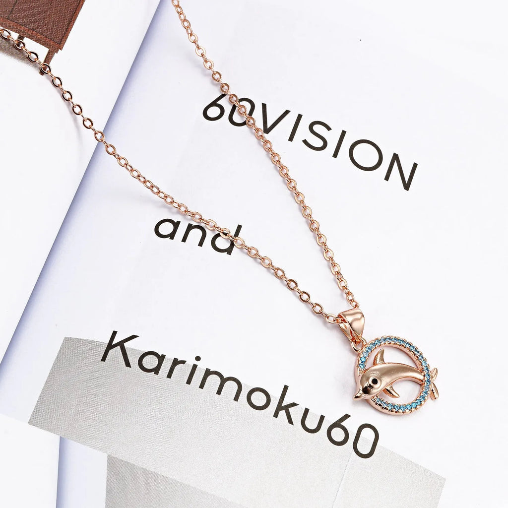 Romantic dolphin copper pendant necklace available in rose gold and silver finishes