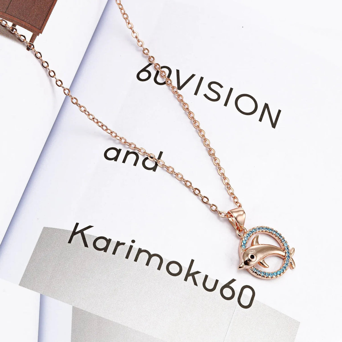 Romantic dolphin copper pendant necklace available in rose gold and silver finishes