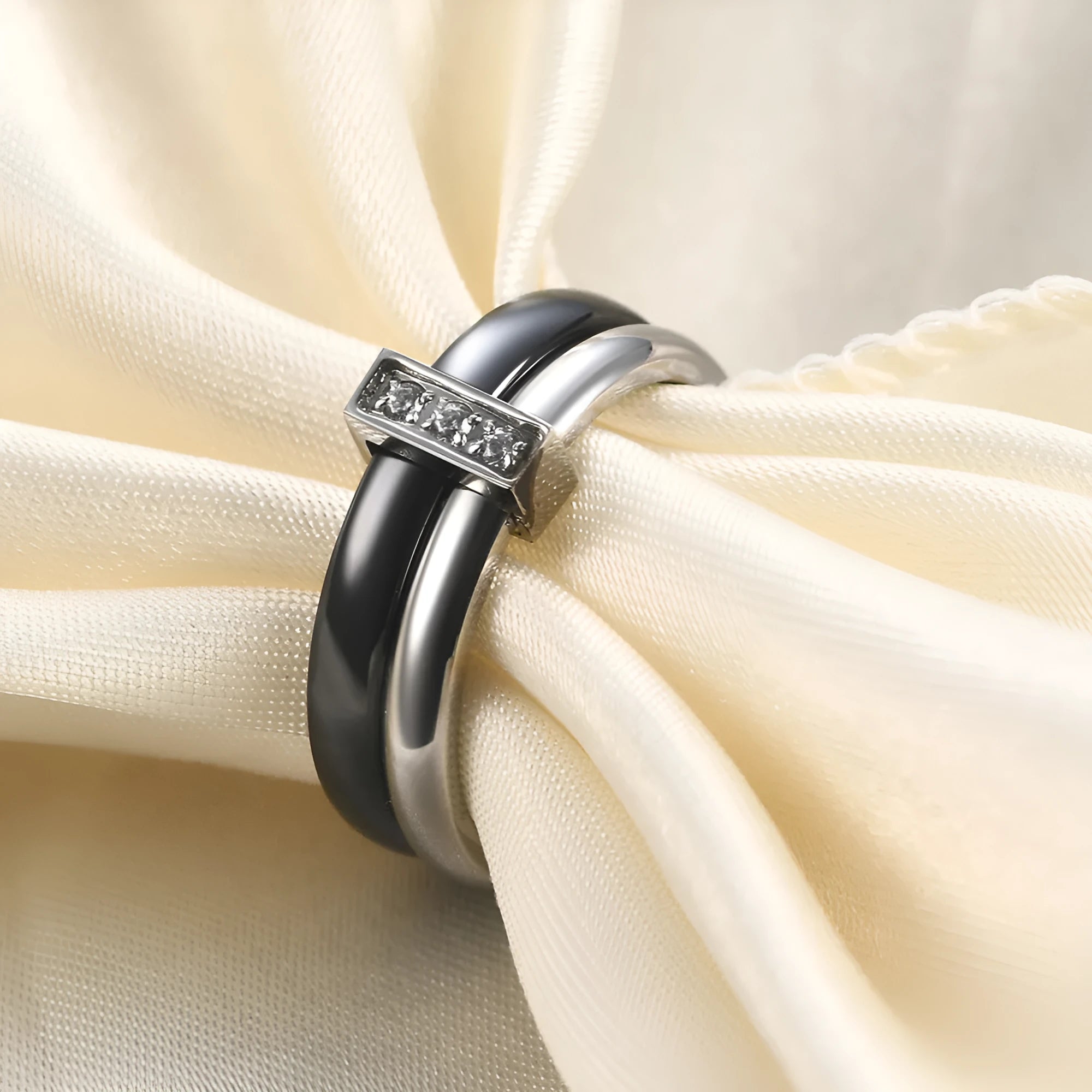 Ceramic geometric ring with glossy stitching and inlaid zirconium on 6MM band, shown in steel black and gold white finishes