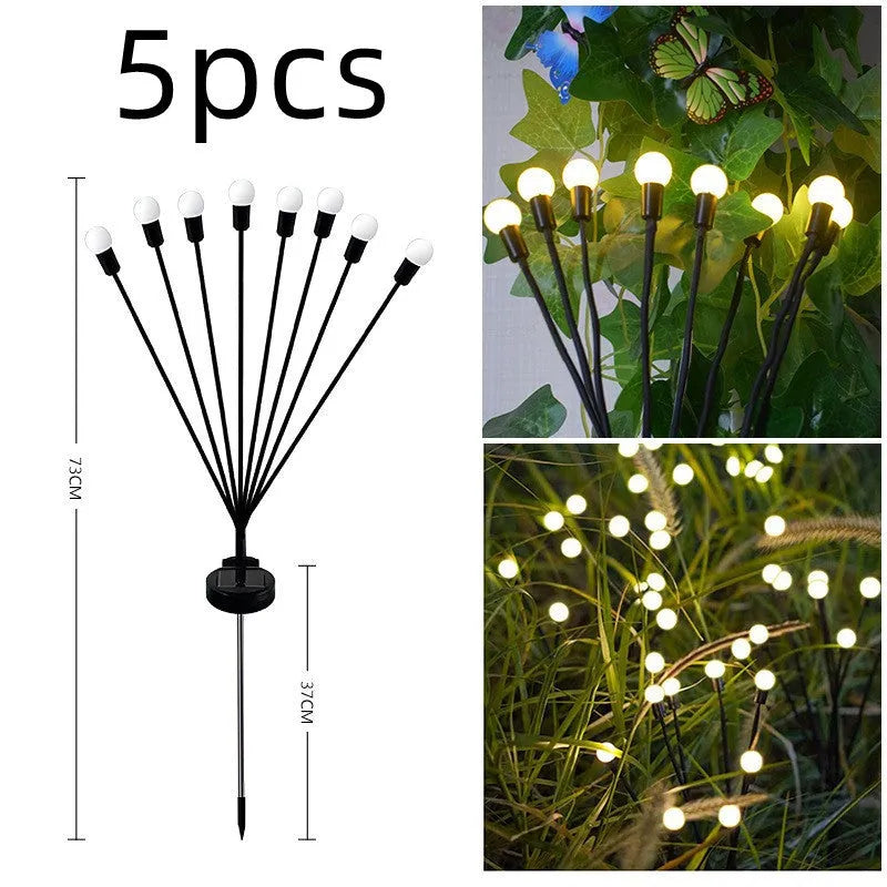 Solar powered LED ground spike garden light with multiple warm white and colour LED heads on stainless steel stake.
