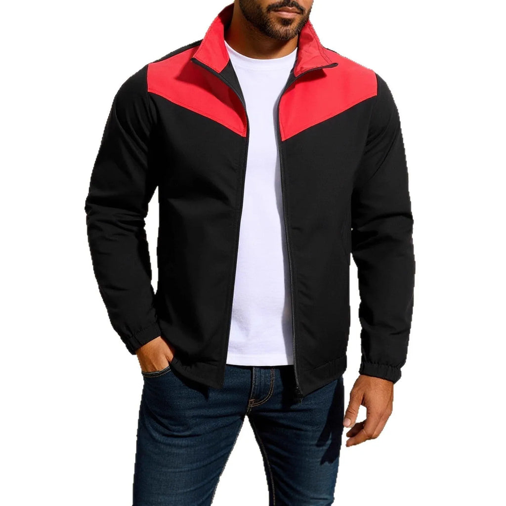 Man wearing a green polyester windproof jacket with a high collar and colour-matched zipper.