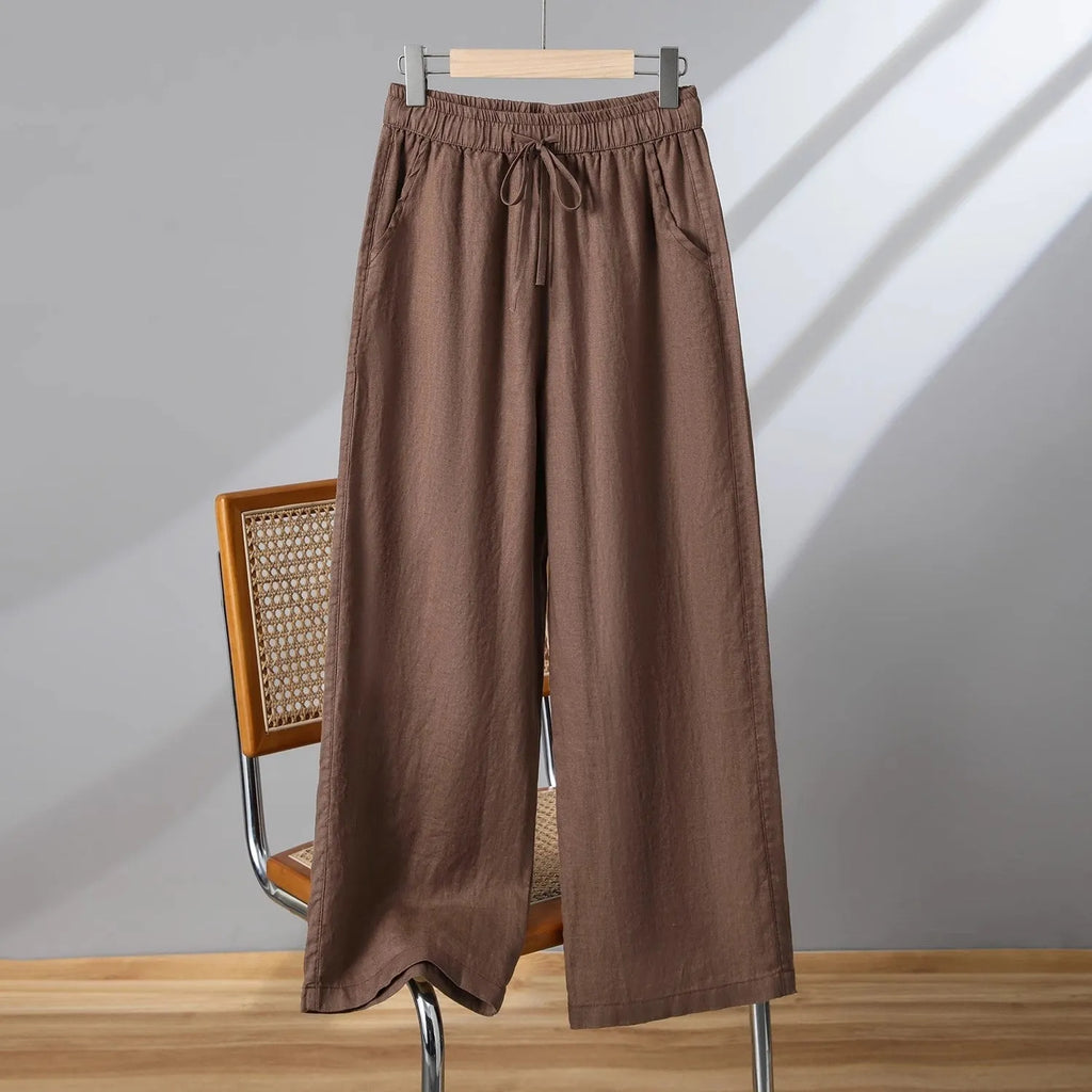 Women's straight-leg casual trousers with elastic waist and drawstring detail in apricot colour