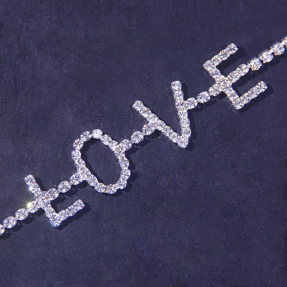 Gold letter anklet spelling LOVE with clear rhinestones on copper chain