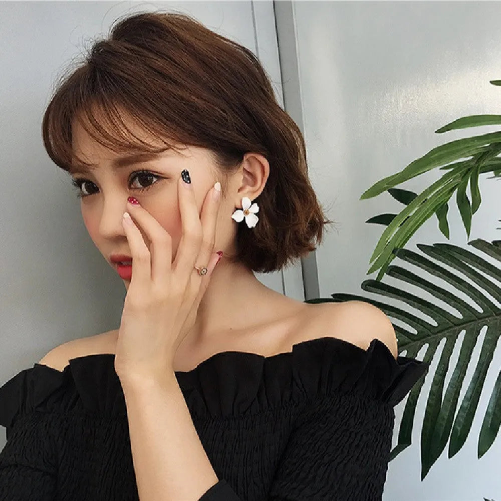 Floral stud earrings for women in white and pink colours with electroplated alloy material