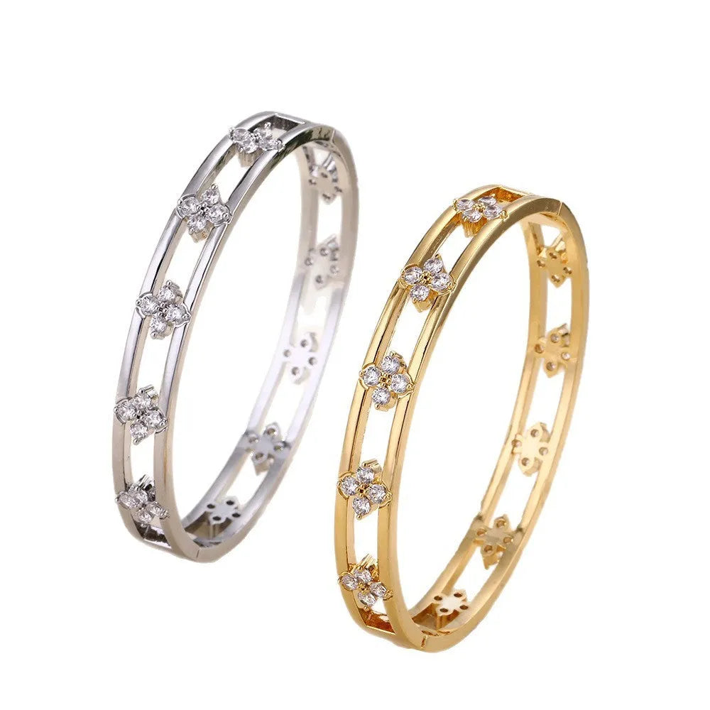 Gold and silver hollow women's bracelets with four-leaf clover charm and zircon stones.