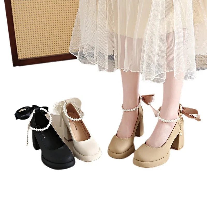 Beige women's Mary Jane shoes with a chunky heel, round toe, and an ankle-strap buckle.