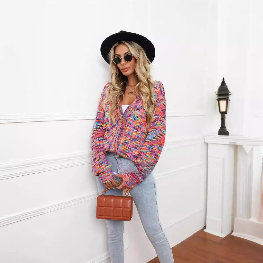 Rose Red rainbow striped loose-fit knitted cardigan coat on a hanger.