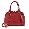 Large shiny black PU leather crossbody bag with structured shell shape design.