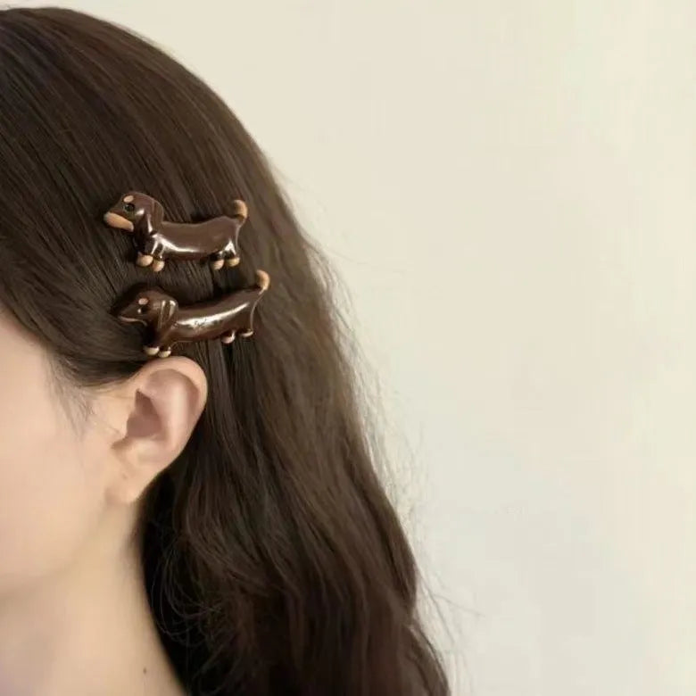 Dachshund dog design hair barrettes with electroplated finish, available as single clip or pair
