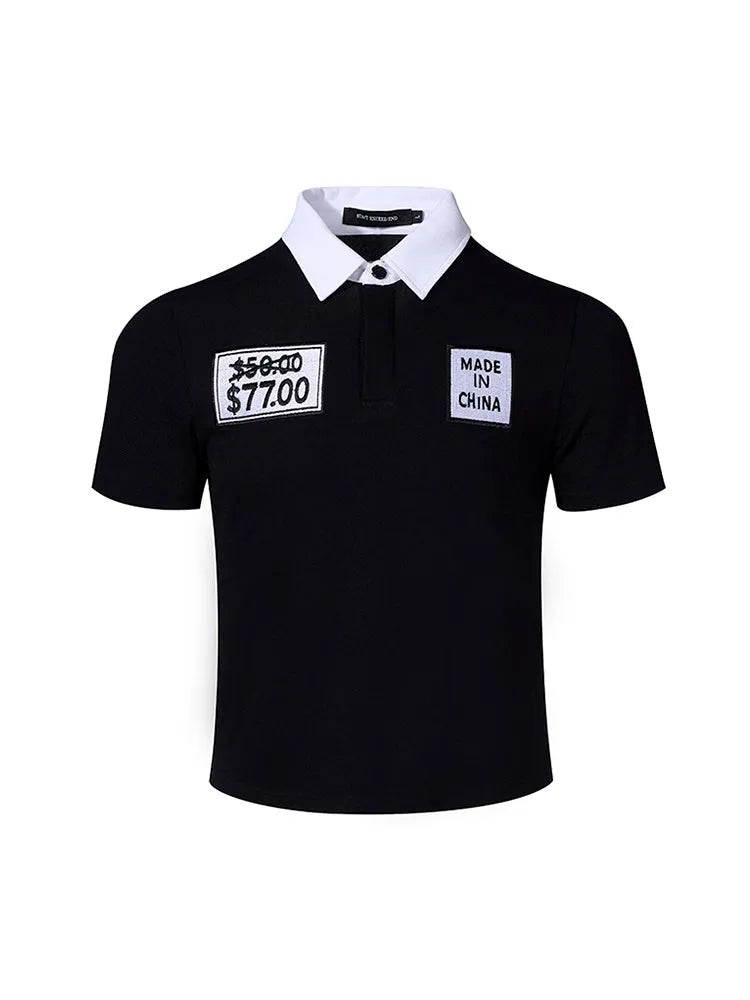 Black slim fit men's short sleeve polo shirt with embroidery detail on a hanger.