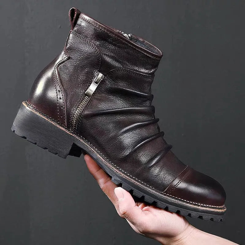 Black side-zip cowboy boot with round toe and a mid-height horseshoe heel on a plain background.