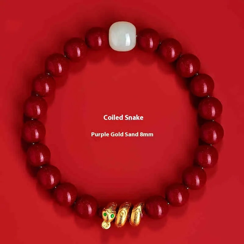 Handmade cinnabar Snake Year bracelet with Chinese zodiac design and roll snake beads.