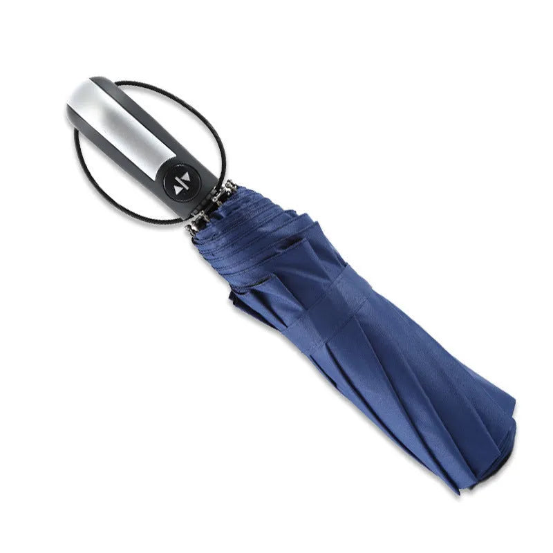Black triple folding business umbrella with automatic opening mechanism and rubber handle