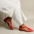 Red women's summer sandals with square buckle detail and low-top design