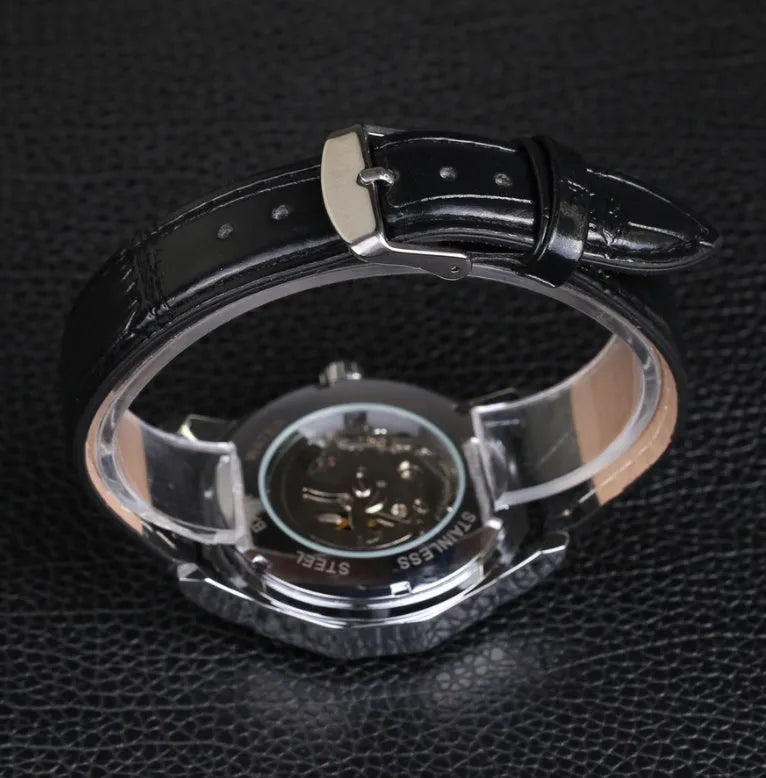 Aqua watch with black strap and white dial showing 4.2cm surface and slim profile
